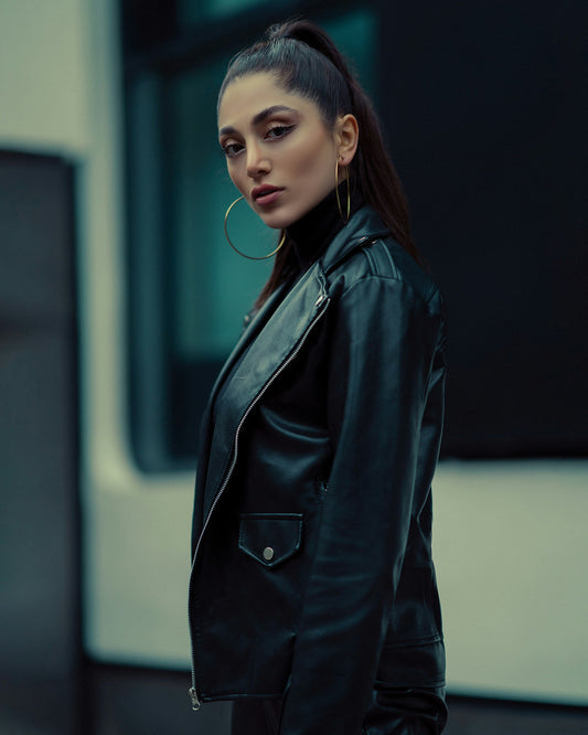 XAYWEAR black leather women outfit worn by woman with hoop earrings in urban setting