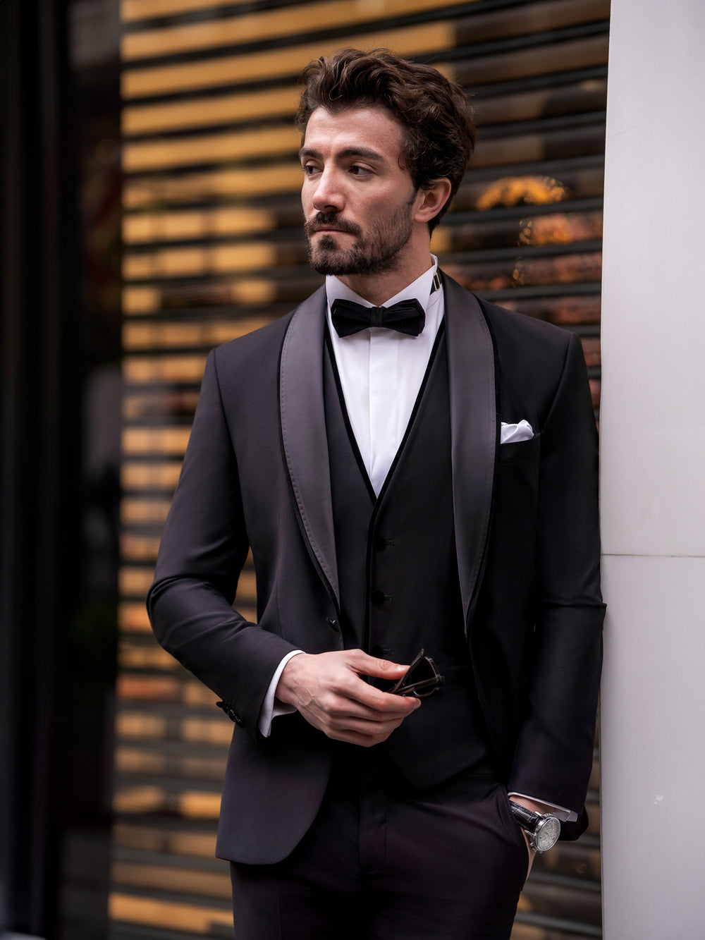 XAYWEAR black suit for men with satin lapel worn with white shirt and black bow tie