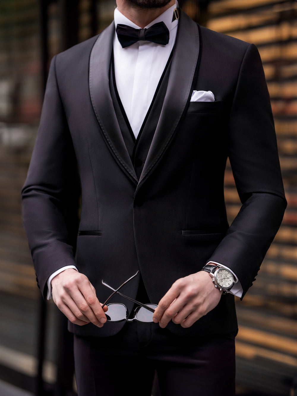 XAYWEAR black suit for men with satin lapels worn with white shirt and black bow tie