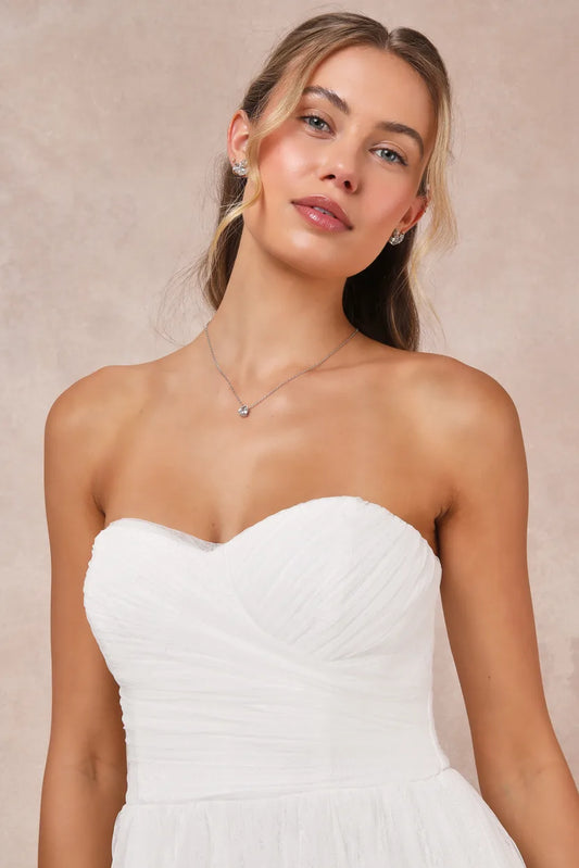 XAYWEAR strapless white bridal gown with ruched bodice and sweetheart neckline