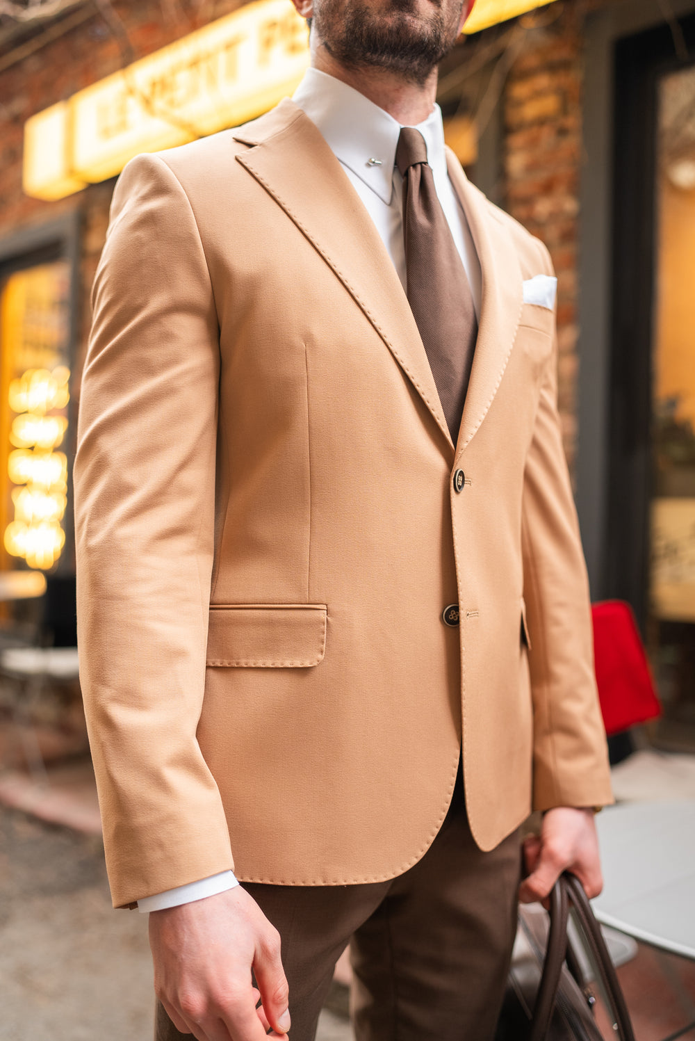 XAYWEAR beige suit for men with notch lapel and two-button closure worn with brown tie