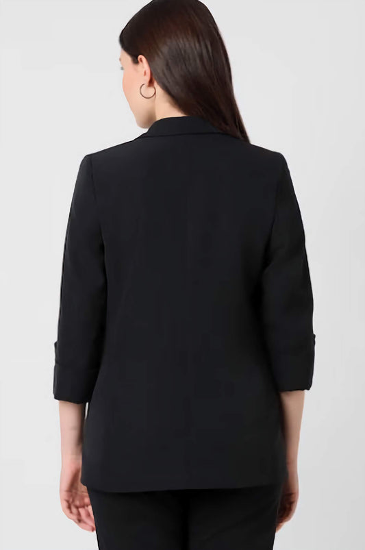 Back view of XAYWEAR formal black blazer for women with three-quarter sleeves and tailored fit