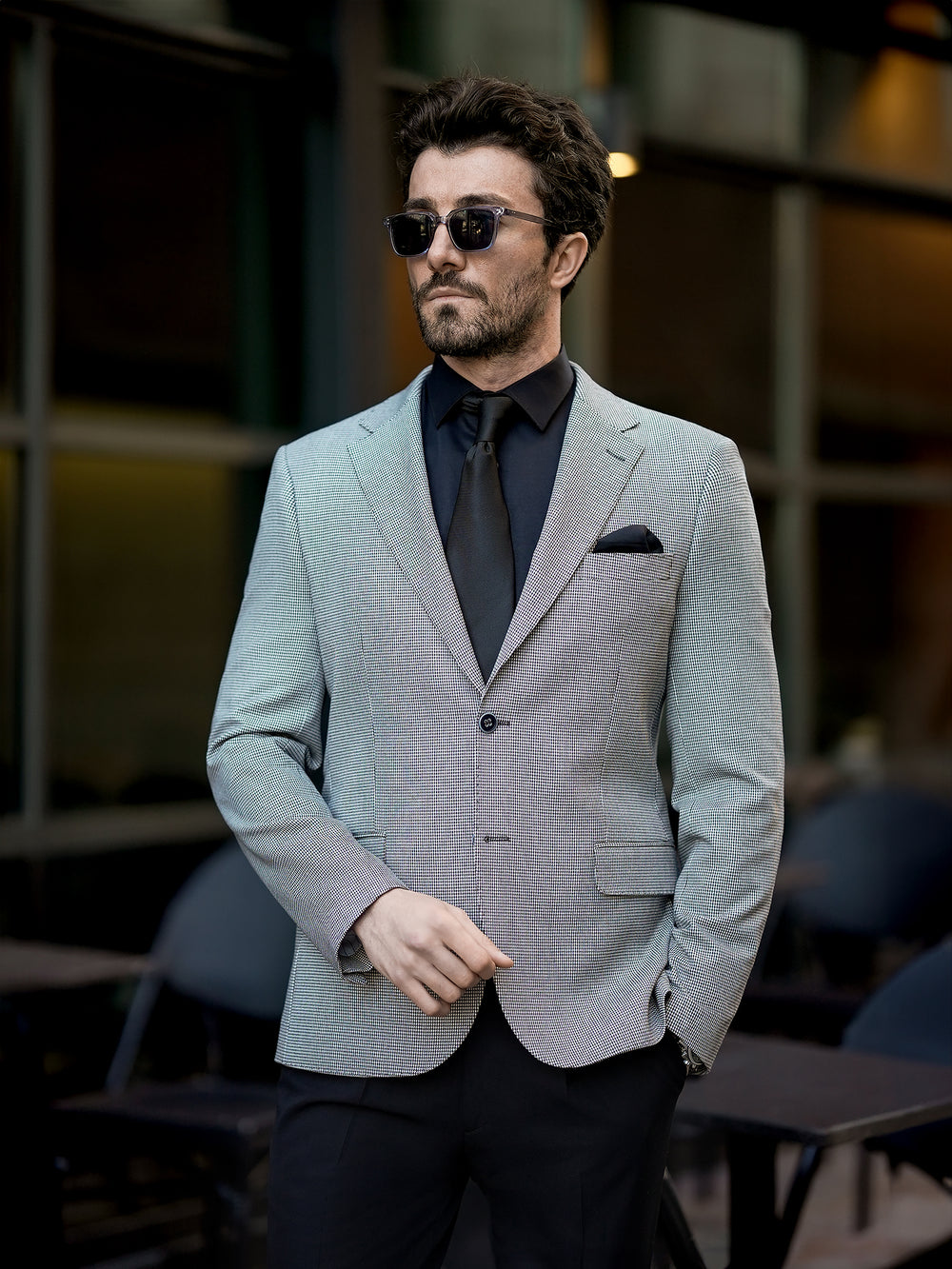 XAYWEAR stylish two piece suit for men in light gray with black shirt and tie, worn with sunglasses