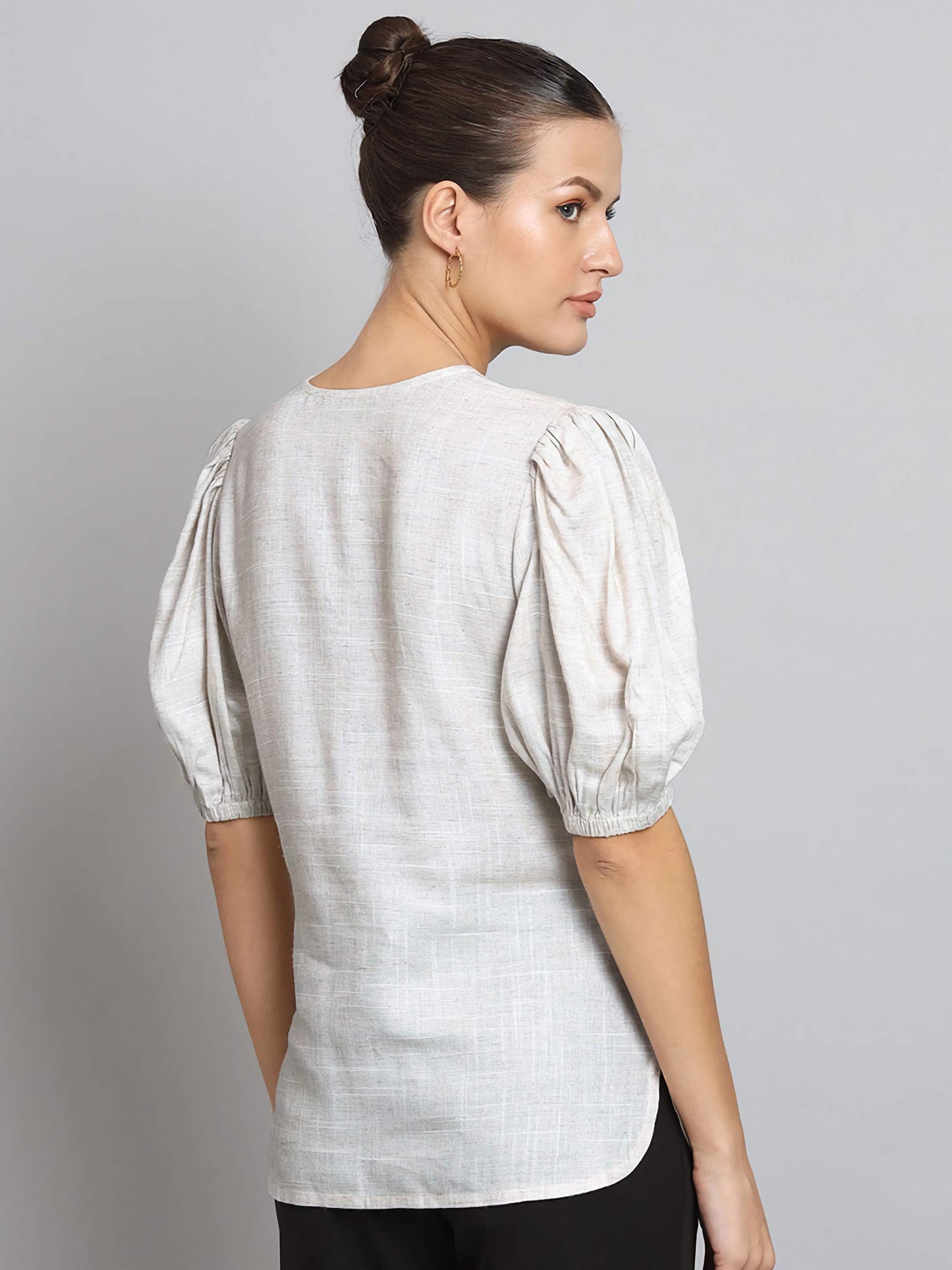 XAYWEAR linen blouse with puff sleeves and round neckline shown from the back