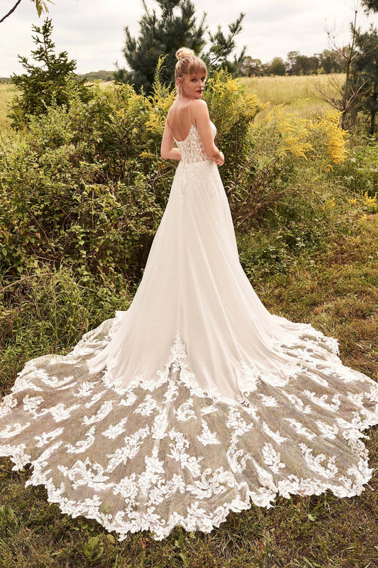 XAYWEAR luxury wedding dress with intricate lace train and open back design in outdoor setting