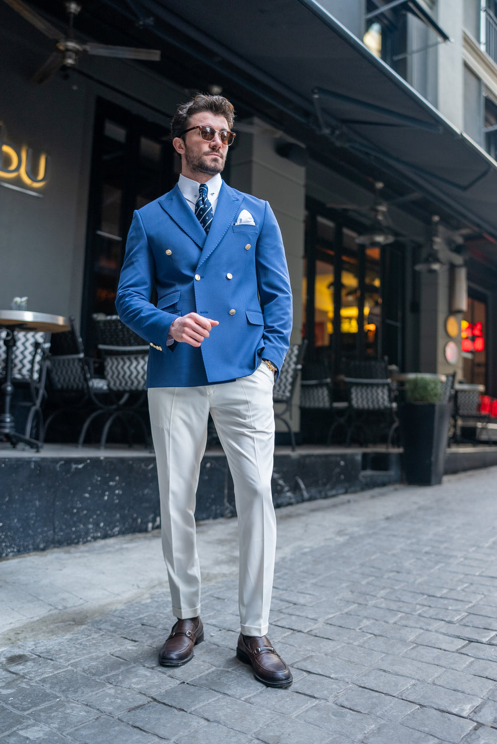 Men blazer suit by XAYWEAR featuring a blue double-breasted blazer with white pants and brown shoes