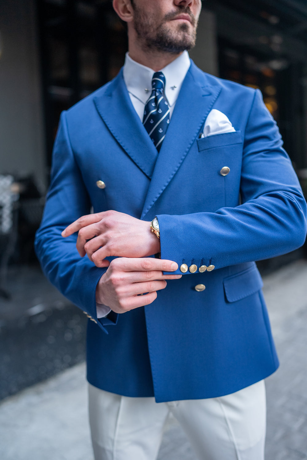 XAYWEAR men blazer suit in blue with gold buttons, paired with white shirt and patterned navy tie