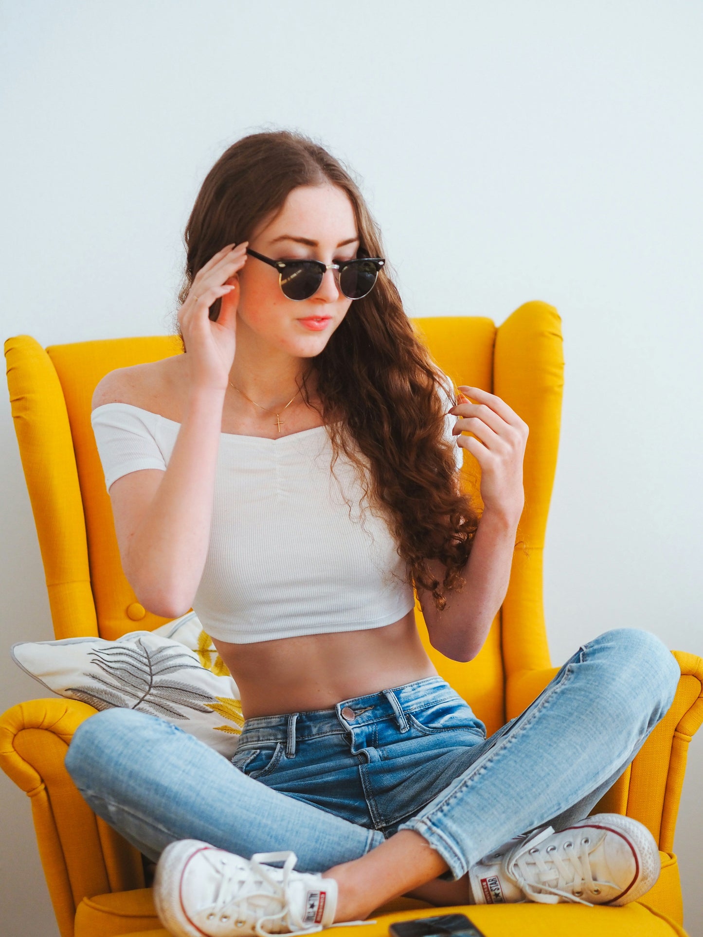 XAYWEAR Off-Shoulder Cropped Tee styled with jeans and sunglasses for a casual look