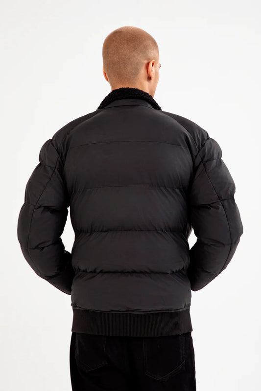 Back view of XAYWEAR puffer jacket for men in black with a cozy collar design