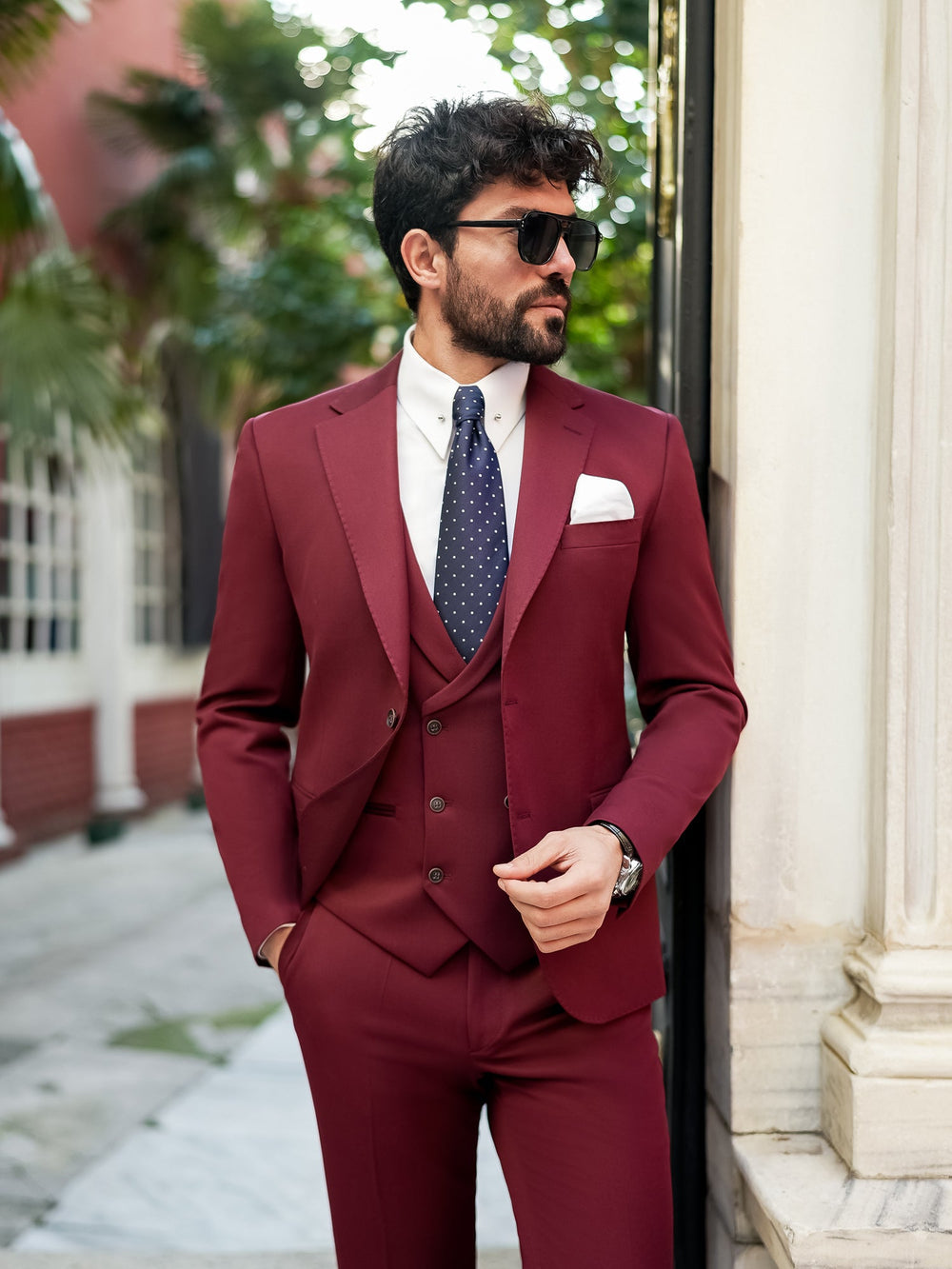 XAYWEAR burgundy suit for men featuring a three-piece design with a white shirt and navy tie
