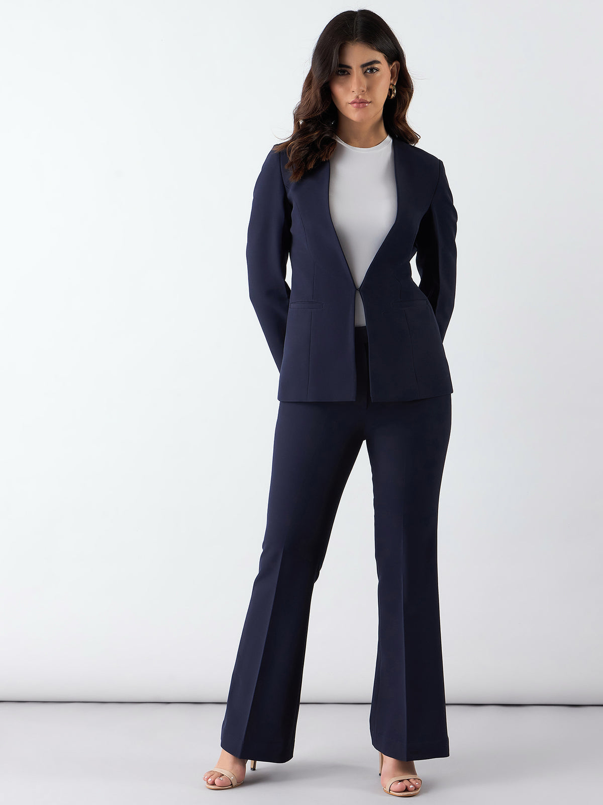 XAYWEAR tailored power suit for women in navy blue with flared pants and a fitted blazer