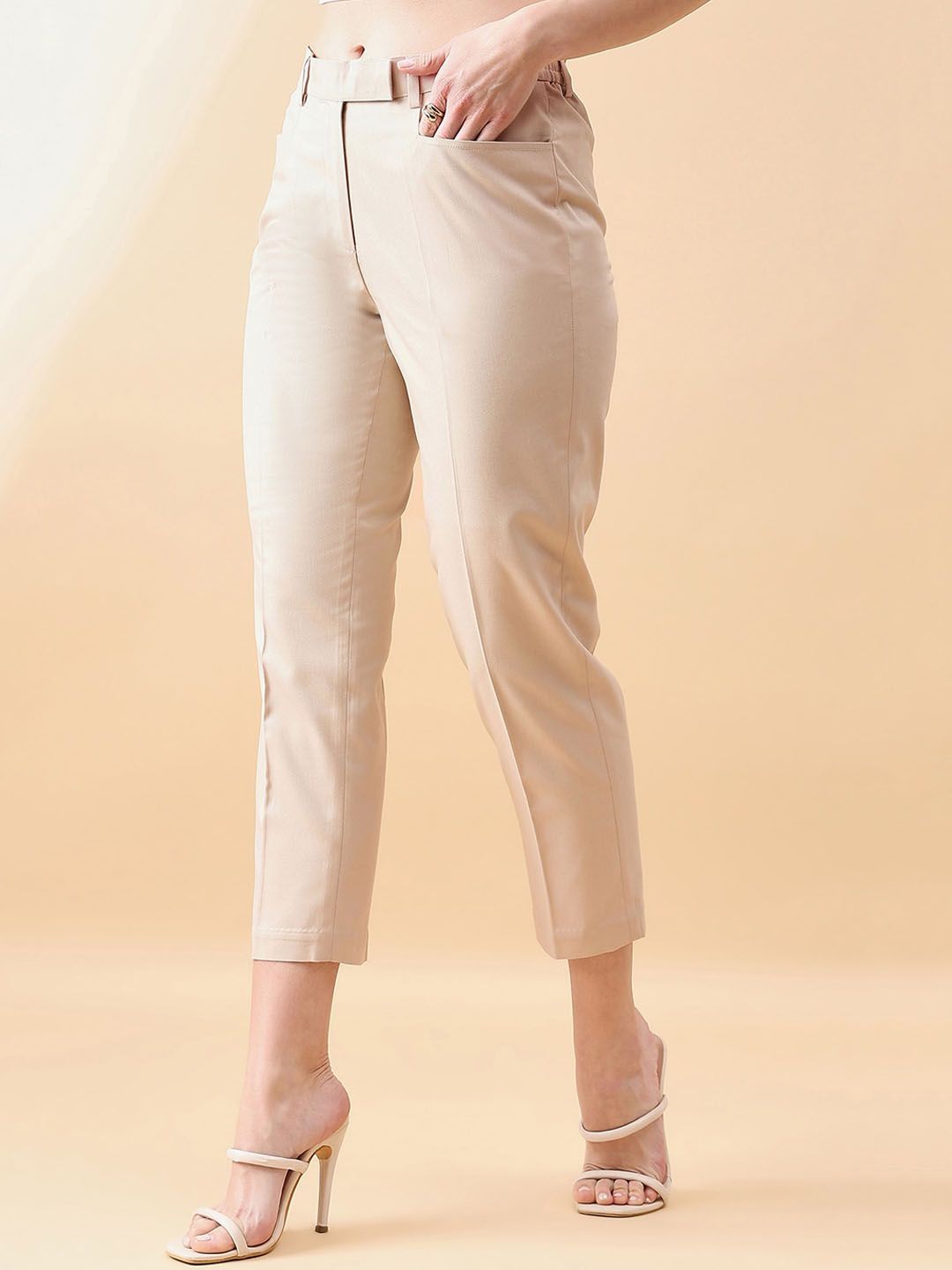 XAYWEAR beige cropped trousers for women styled with high heels for a chic look