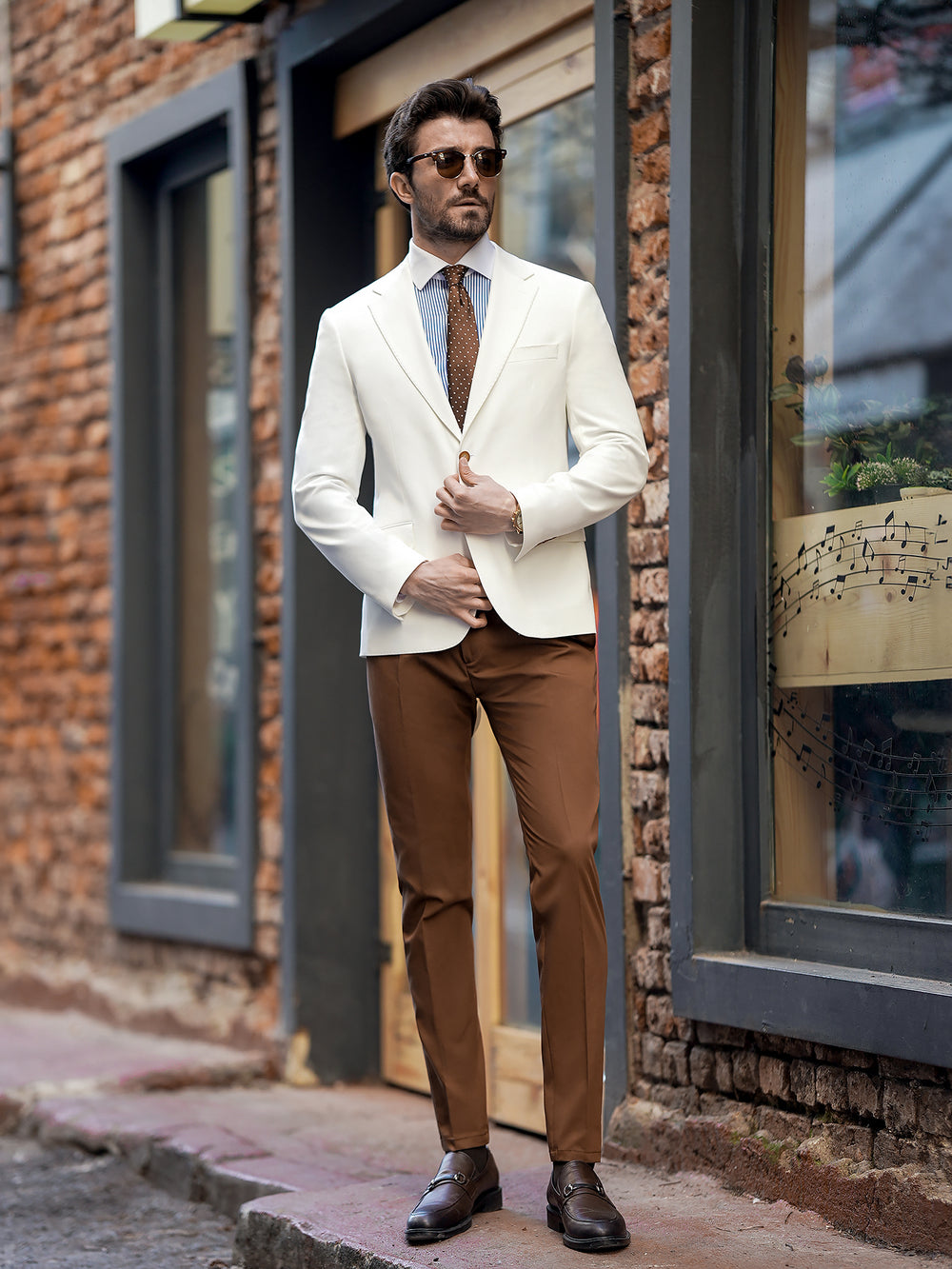 Stylish two piece suit for men by XAYWEAR featuring white blazer and brown pants with matching tie