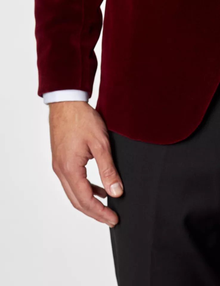XAYWEAR deep red velvet tuxedo for men blazer sleeve and black pants close-up