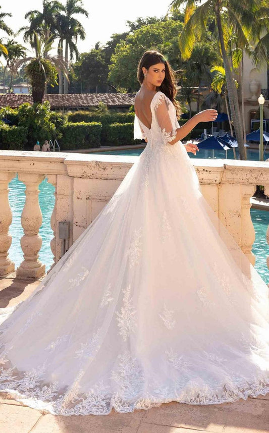 XAYWEAR wedding dress with long lace train and deep V back worn outdoors
