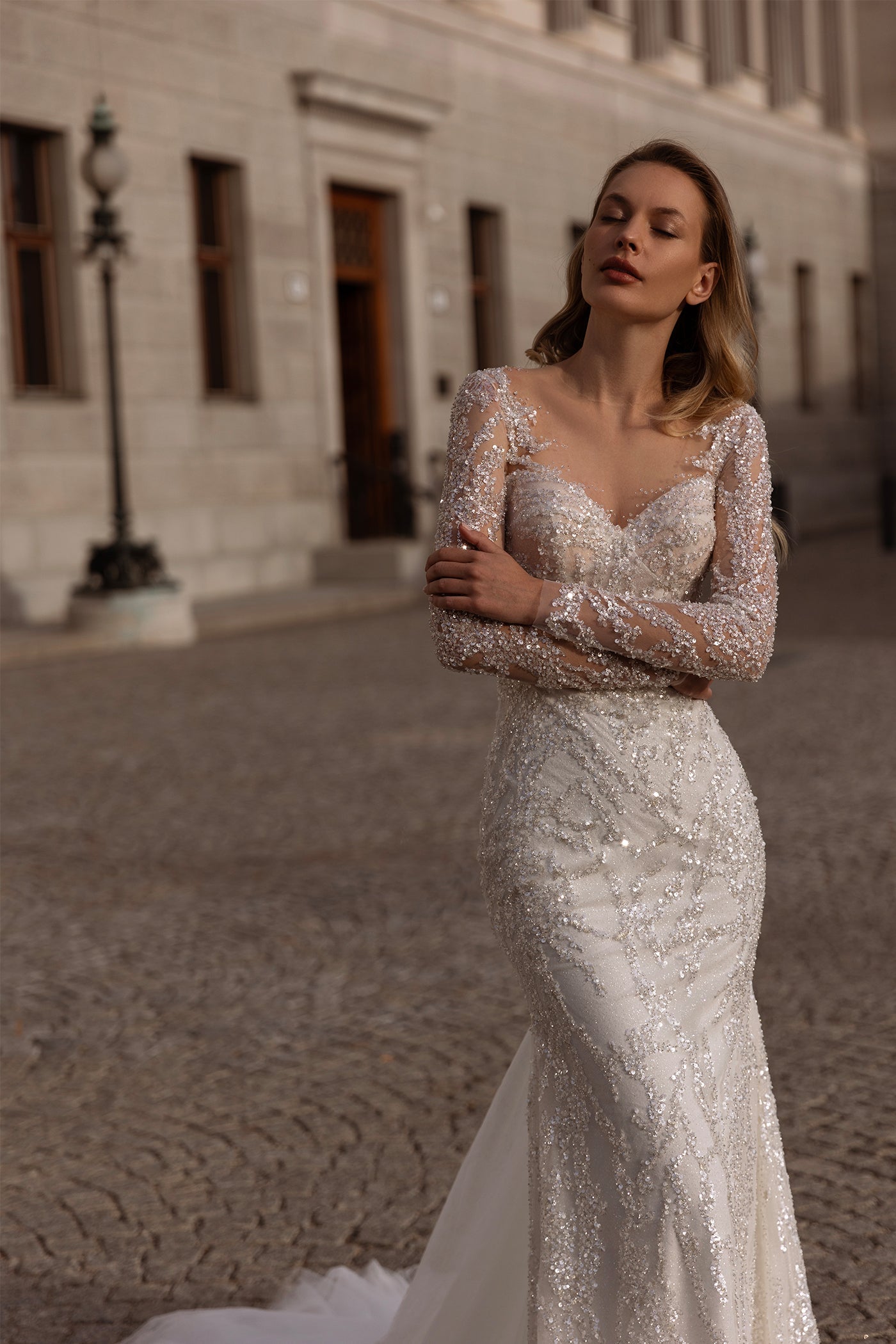 XAYWEAR elegant wedding dress with long sheer lace sleeves and intricate beadwork on fitted gown