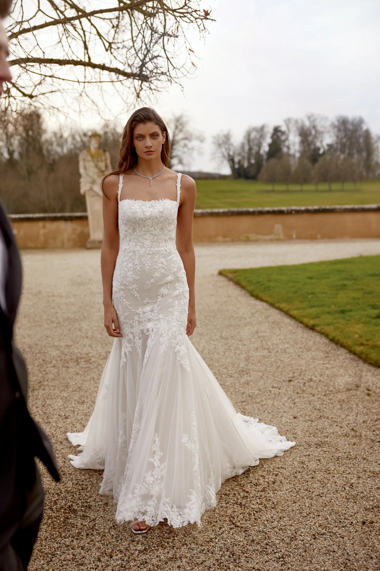 XAYWEAR elegant lace wedding dress with fitted bodice and flowing skirt outdoors