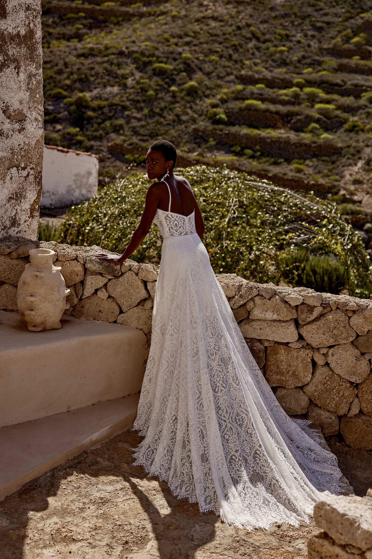 XAYWEAR elegant lace wedding gown with long train worn by bride outdoors