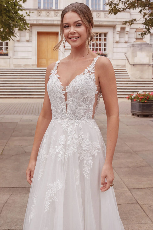 XAYWEAR white lace wedding dress gown with floral appliques and sheer straps on smiling bride