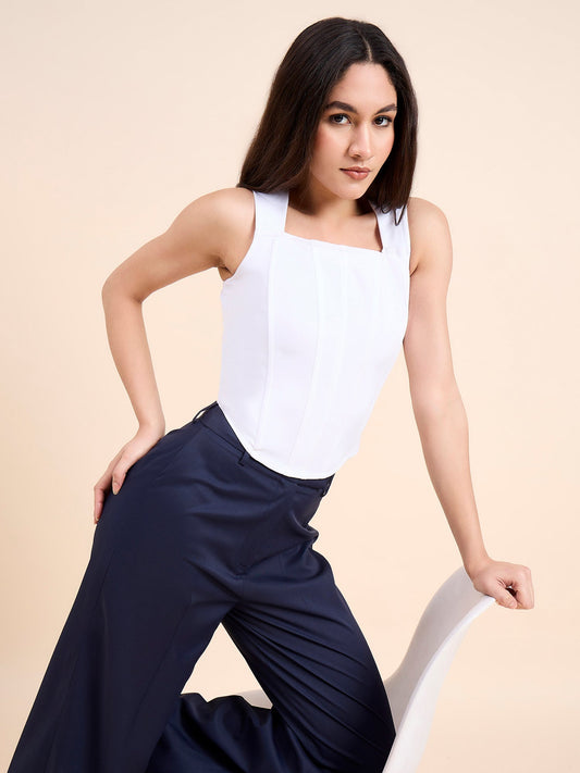 XAYWEAR stylish white women outfit featuring a sleeveless white top paired with navy wide-leg pants