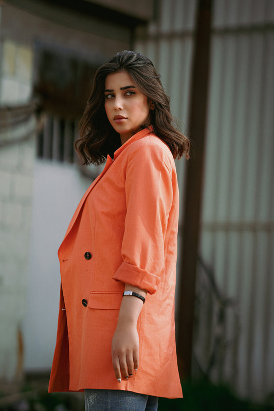 XAYWEAR orange blazer styled as a women coat with double buttons and rolled sleeves