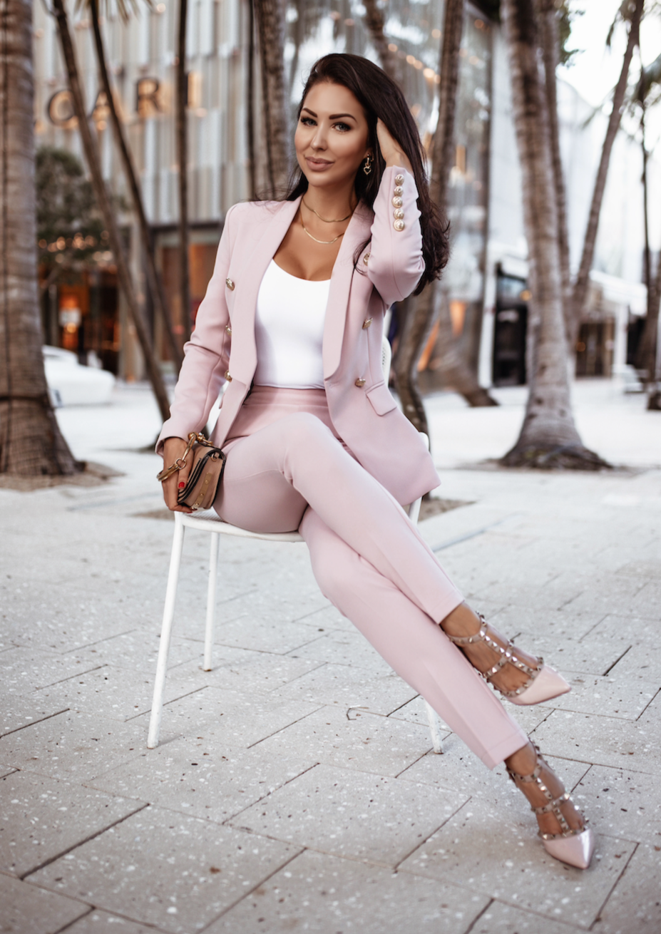 XAYWEAR women formal suit in pink with tailored blazer and slim pants styled with heels and a white top