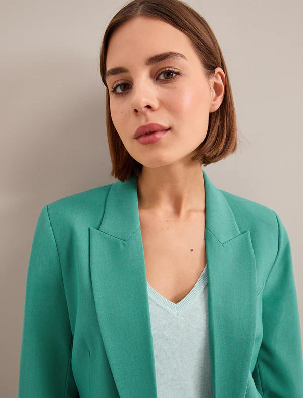 XAYWEAR green blazer for women formal wear styled with light blue top on model