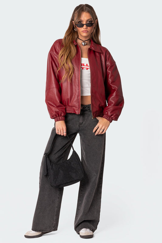XAYWEAR women leather jacket in burgundy with elastic cuffs worn with black pants and white sneakers