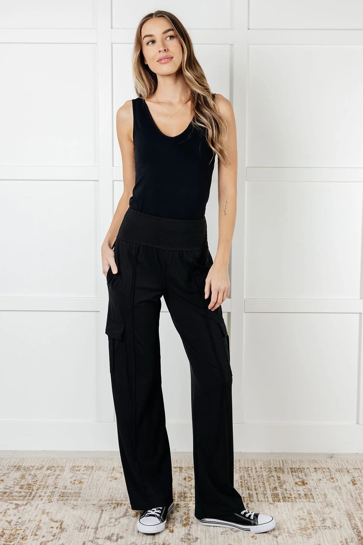 Women's black wide-leg cargo pants with side pockets and a comfortable waistband for casual wear