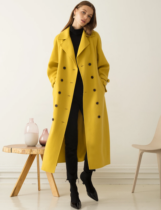 XAYWEAR long yellow winter coat women styled with black outfit and heels for elegant look