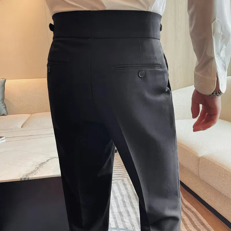 XAYWEAR black dress pants shown from back on a man wearing a white shirt in a modern living room