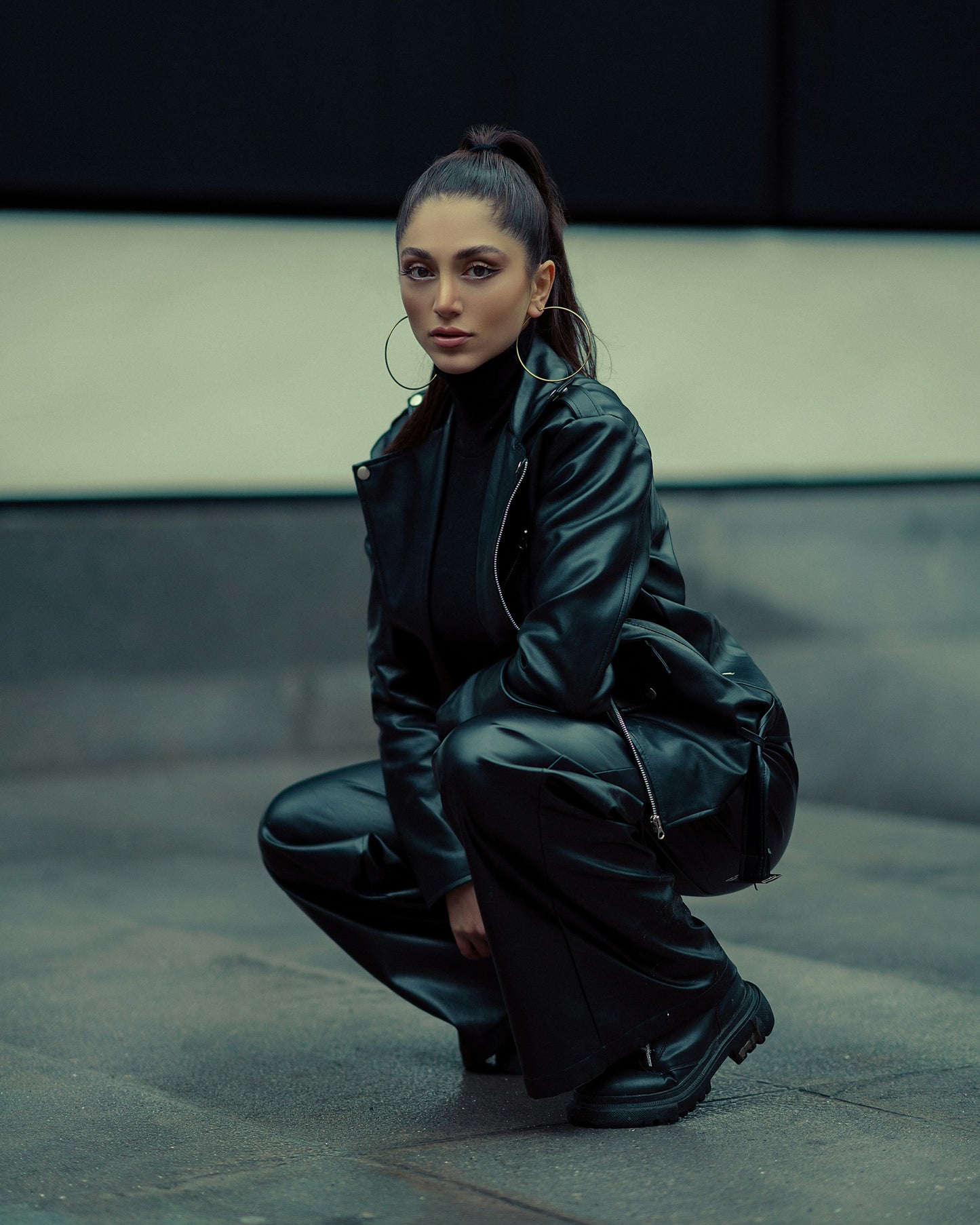 XAYWEAR black leather women outfit featuring jacket and pants worn with black boots