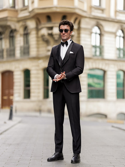 XAYWEAR black men suit with bow tie and white shirt worn by man in classic city setting