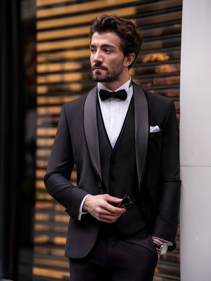 XAYWEAR black suit for men with satin lapel worn with white shirt and black bow tie
