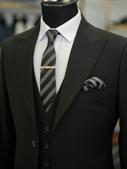 XAYWEAR black three piece suit with white shirt and striped tie on mannequin