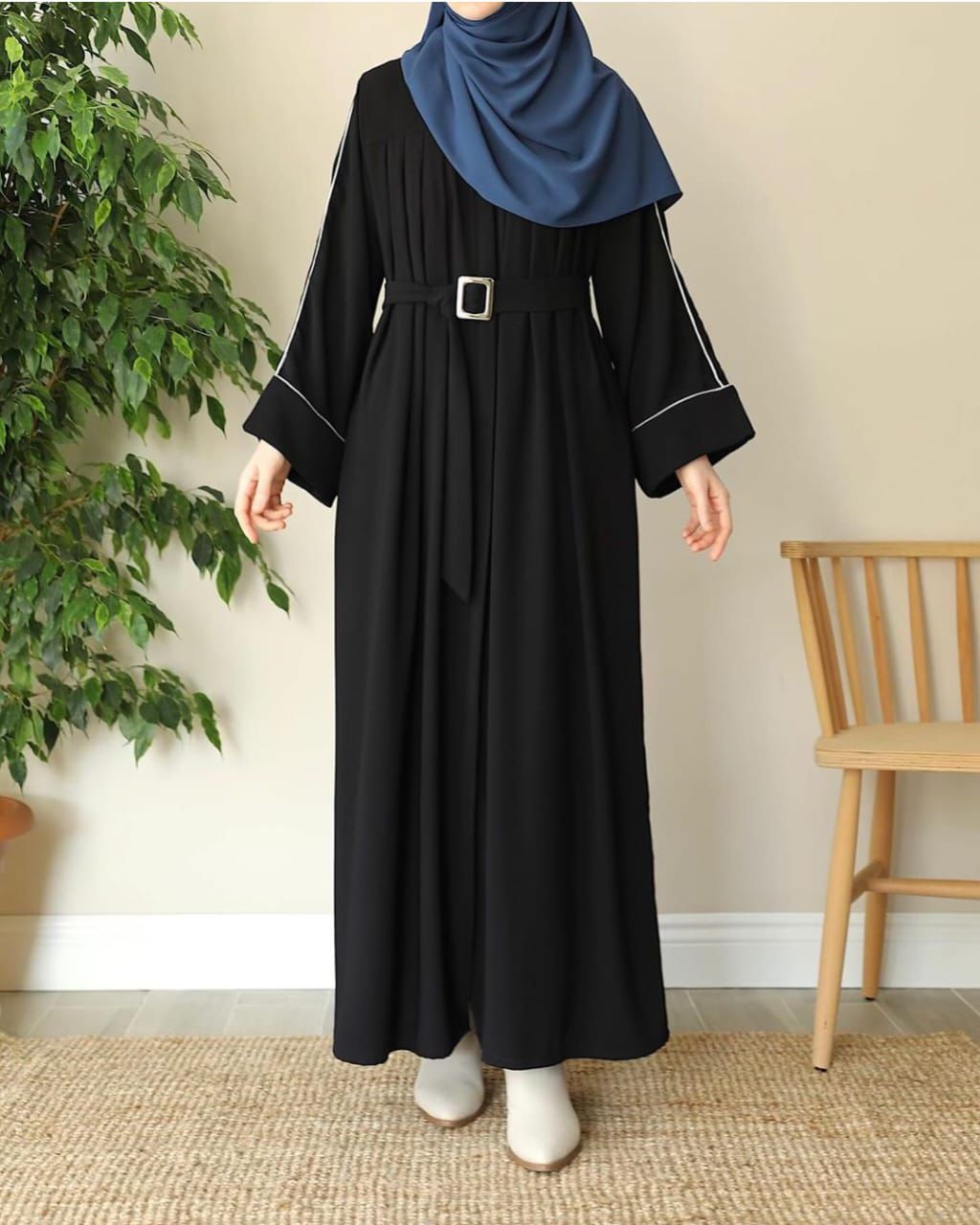 Elegant black zip neck abaya by XAYWEAR with a stylish belt and long sleeves