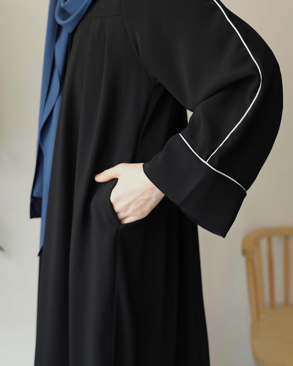 Stylish black zip neck abaya with elegant sleeves and side pocket detail