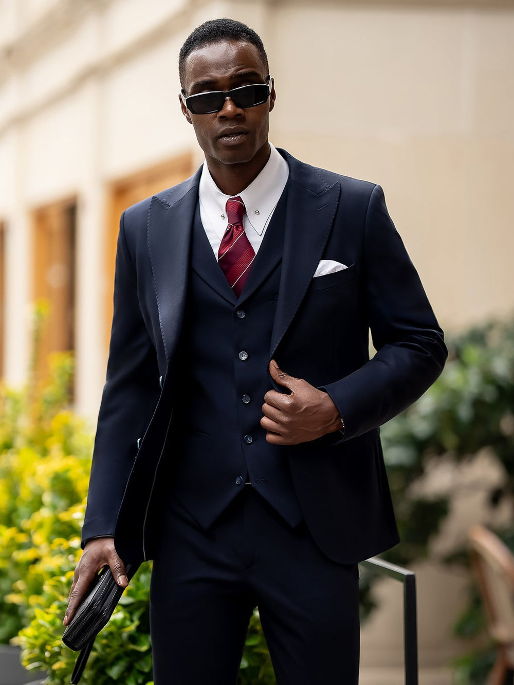 Stylish blue suit for men by XAYWEAR featuring a three-piece design with a white shirt and red tie