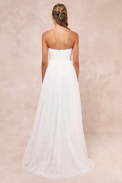XAYWEAR strapless white bridal gown with flowing skirt and fitted bodice back view