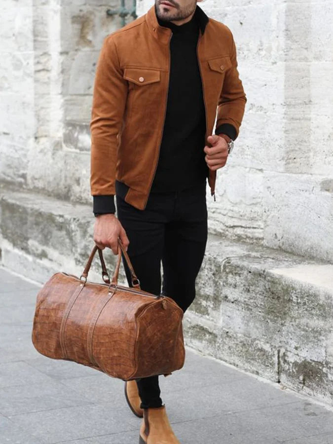 XAYWEAR stylish brown winter jacket for men worn with black pants and brown boots holding a leather duffle bag