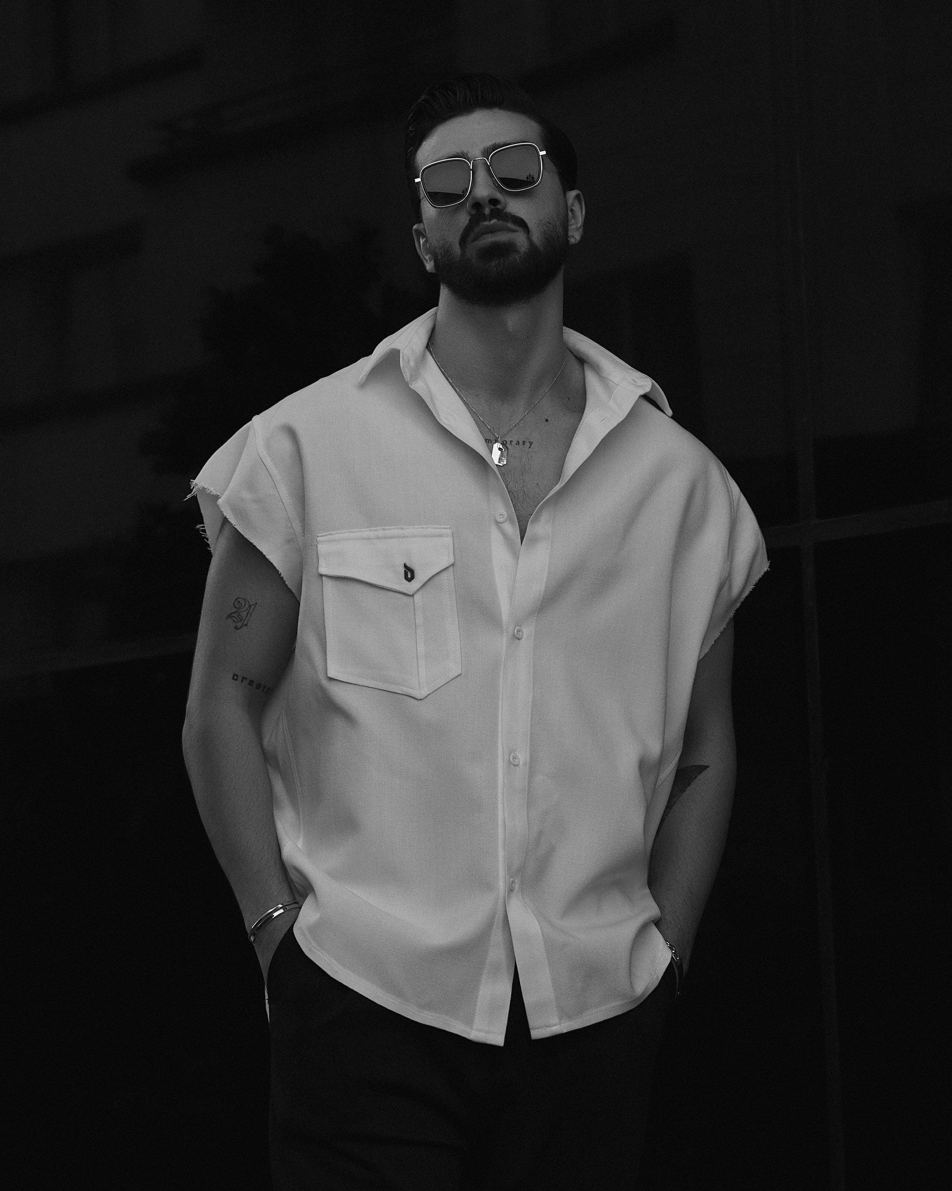 XAYWEAR button-up sleeveless shirt for men in stylish white design with front pocket and relaxed fit