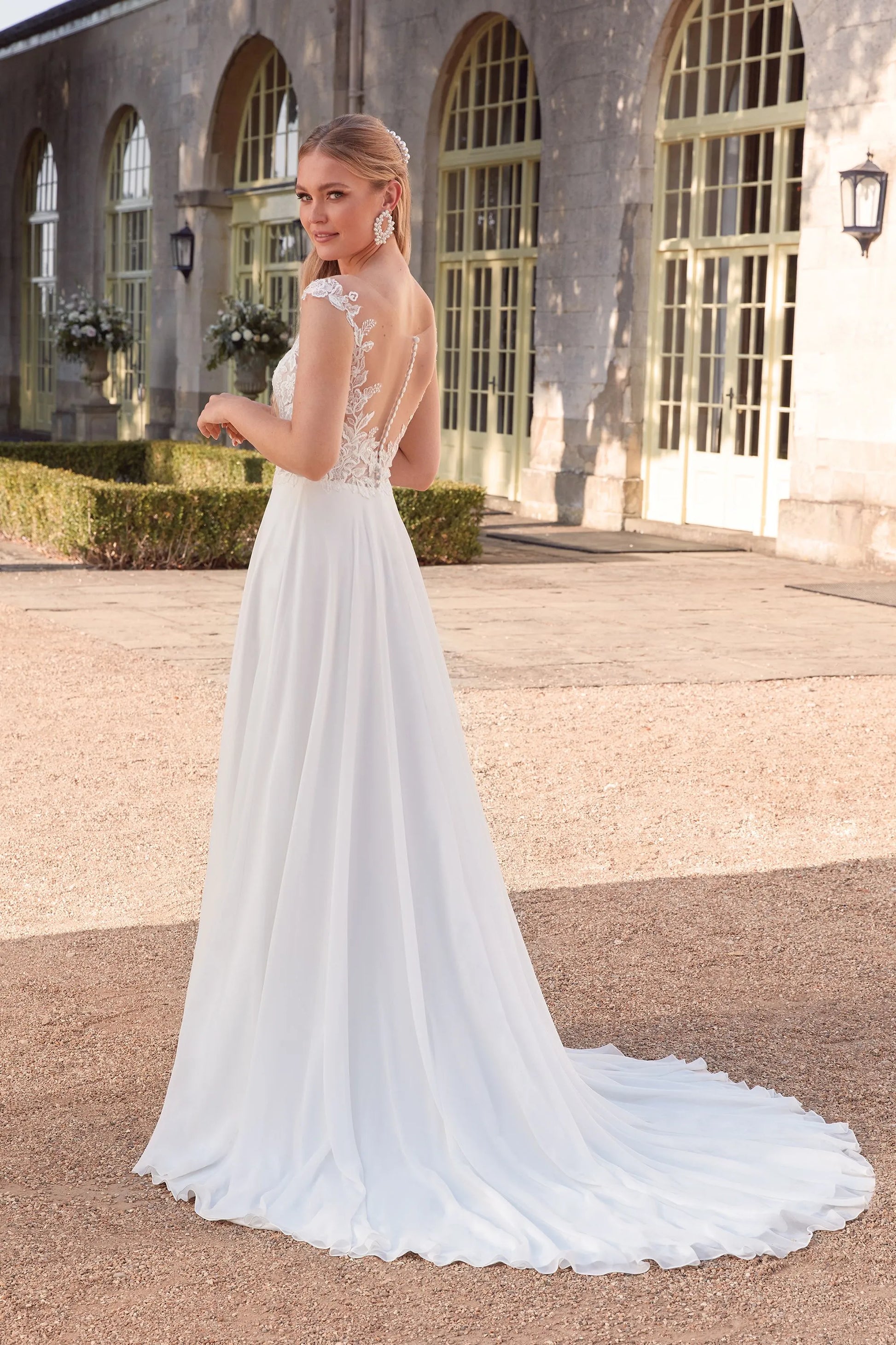 XAYWEAR elegant chiffon wedding dress gown with lace back and flowing train on woman outdoors