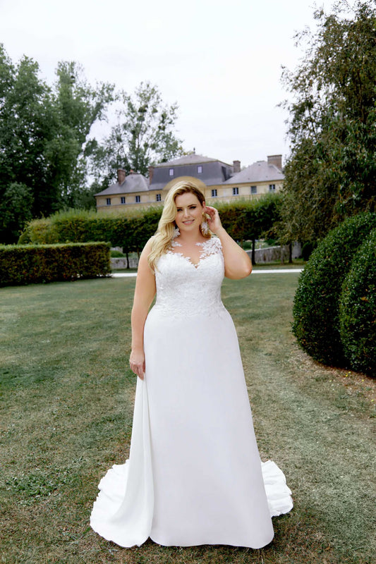 XAYWEAR chiffon wedding gown featuring lace bodice and flowing skirt worn outdoors