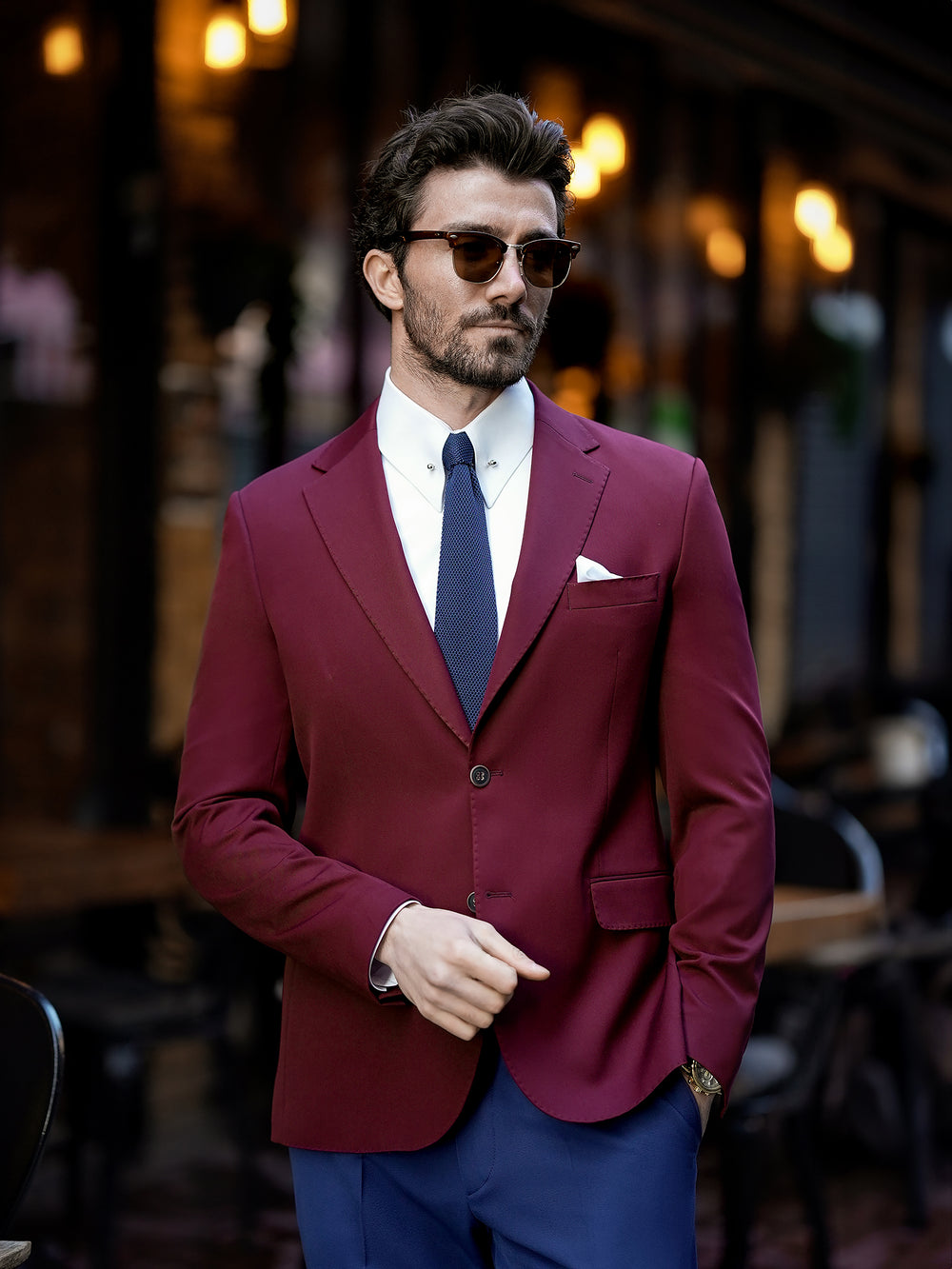 XAYWEAR burgundy blazer suit for men with white shirt and navy tie in outdoor urban setting