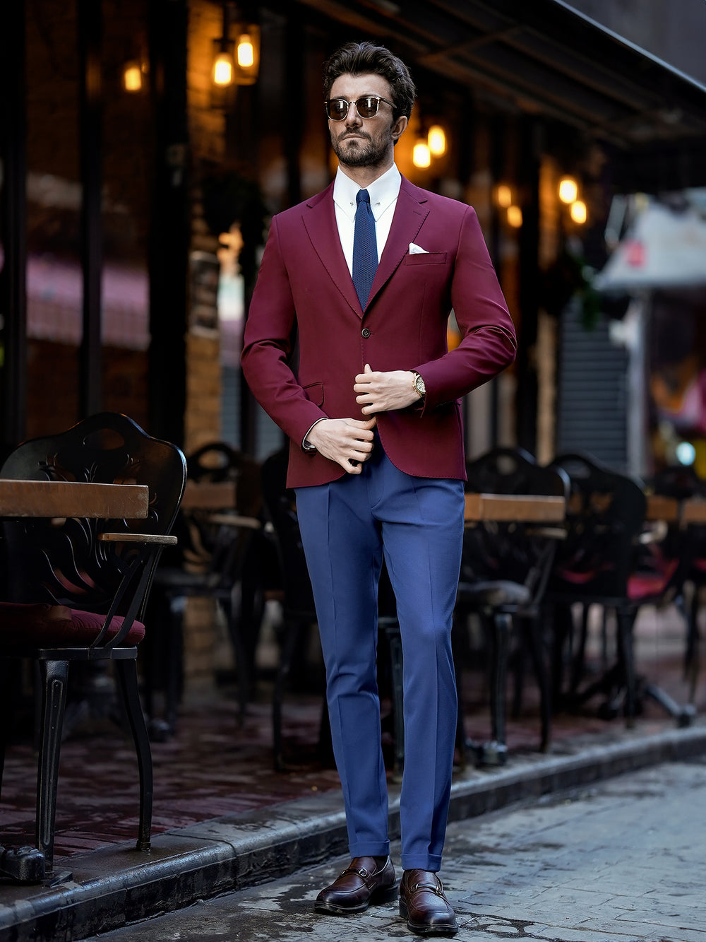 Stylish suit for men by XAYWEAR featuring a burgundy blazer and blue pants with a white shirt and tie
