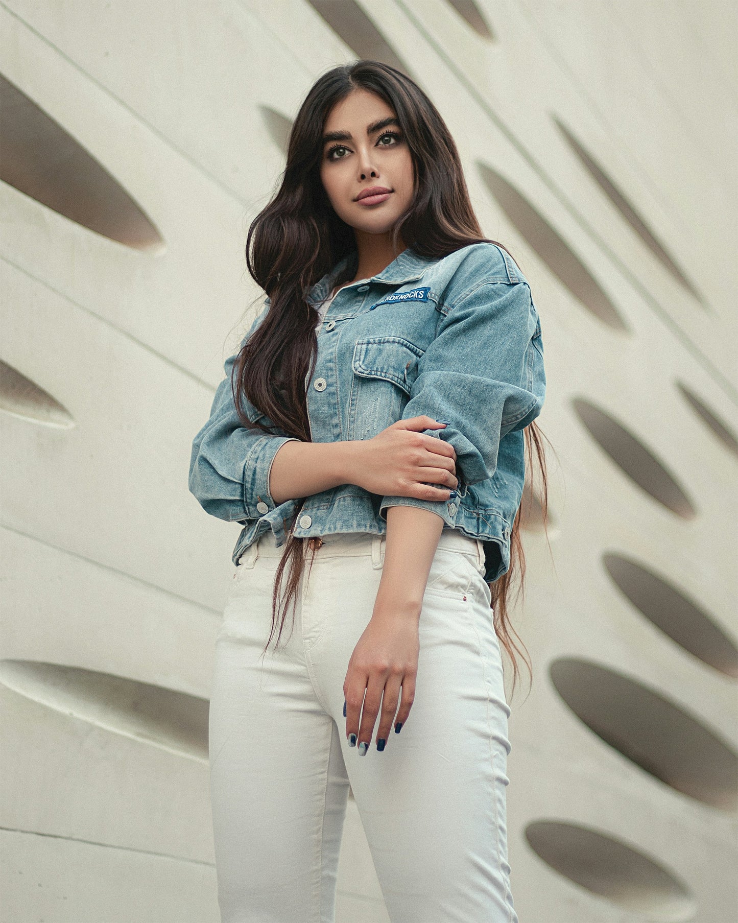 XAYWEAR denim jacket for women styled with white pants, featuring a cropped fit and button details