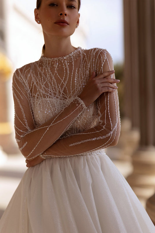 XAYWEAR bridal gown with sheer embellished long sleeves and full tulle skirt