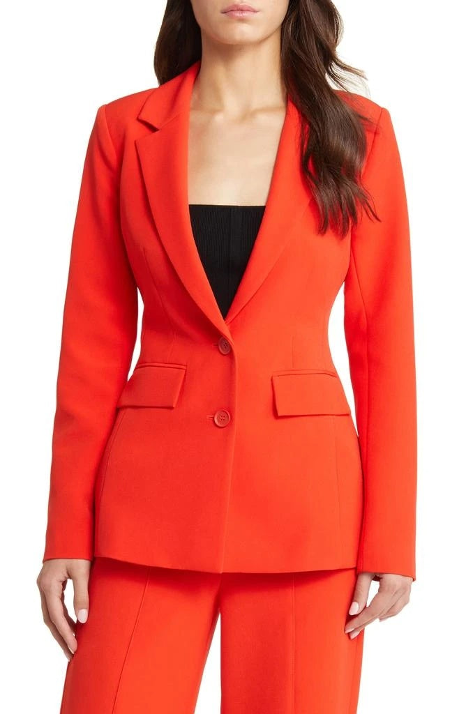 Elegant orange suit for women featuring a tailored blazer and chic design for a polished look