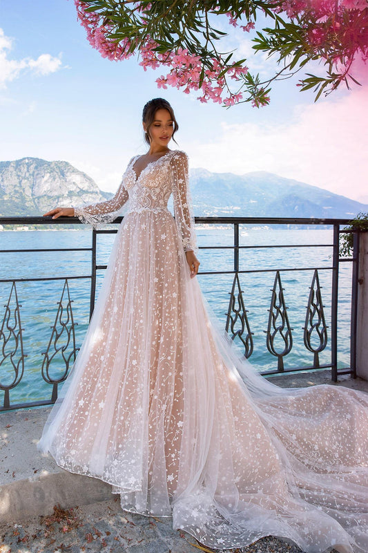 XAYWEAR embroidered tulle wedding gown with long sleeves and flowing train by the lake