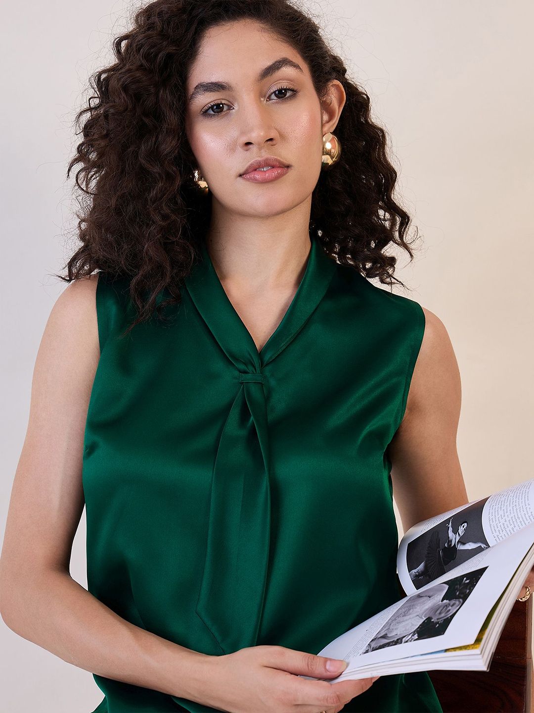 Emerald Satin Sleeveless Blouse with a Tied Neck Detail for Elegant Styling